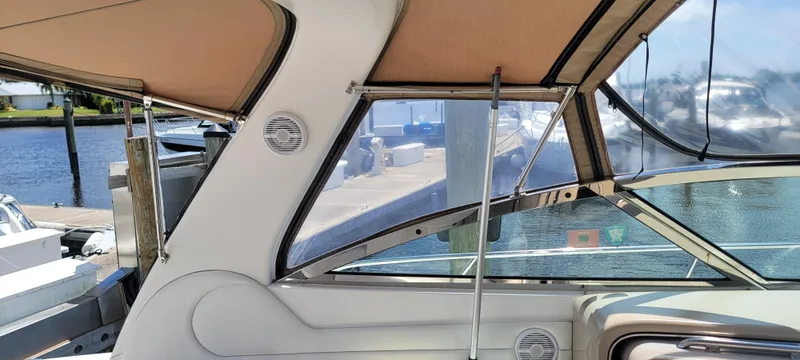 Slide: The Image of Interior view of 2000 Sea Ray 380 Sundancer boat with beige canopy. - 22