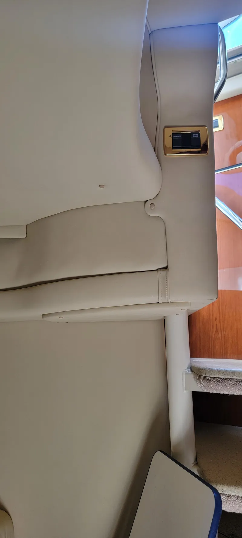 Slide: The Image of Interior of 2000 Sea Ray 380 Sundancer yacht with beige seating and wooden accents. - 26