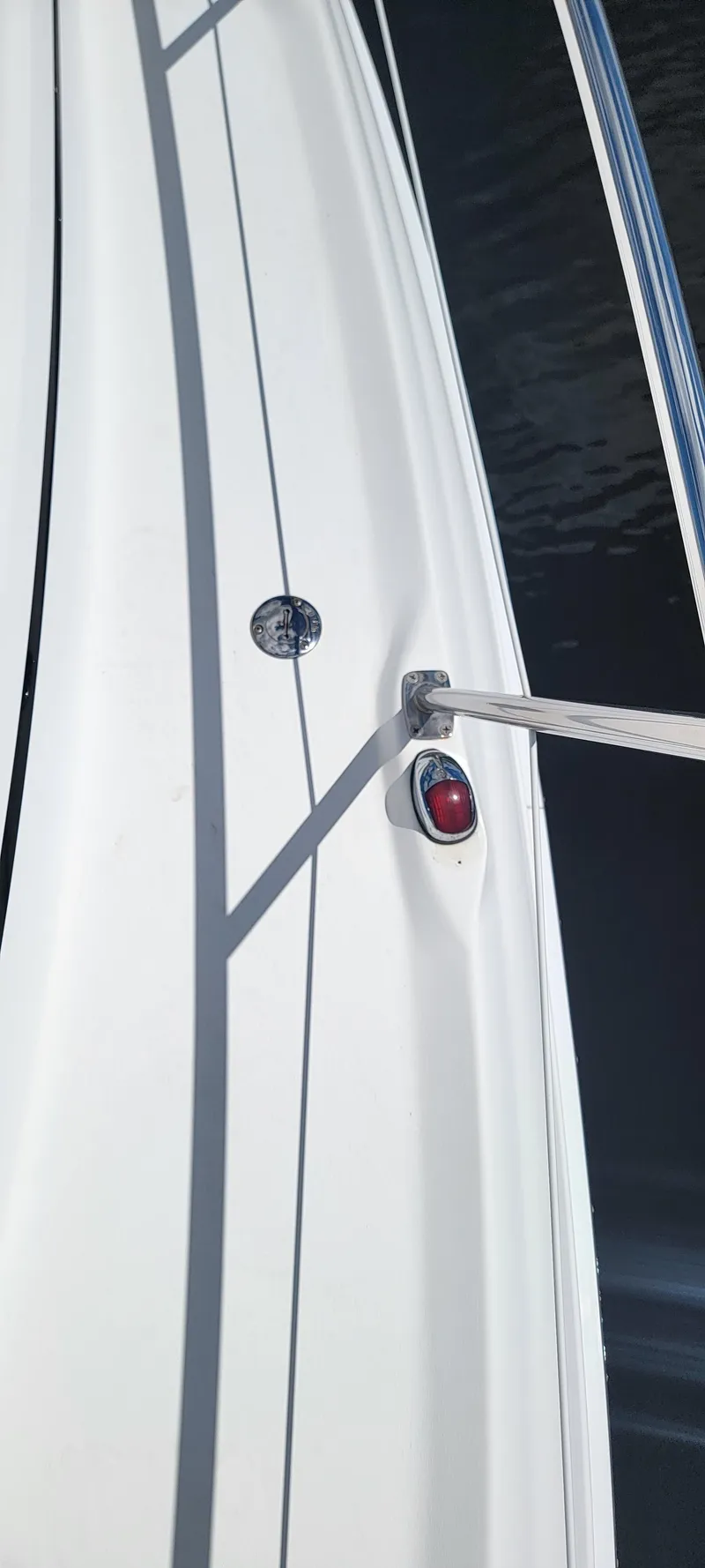 Slide: The Image of Close-up of 2000 Sea Ray 380 Sundancer boat deck with railing and light. - 45