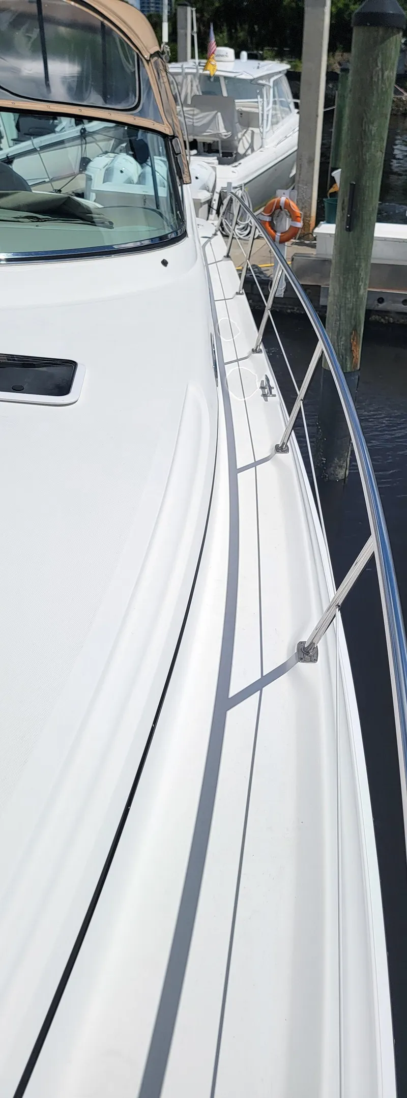Slide: The Image of Side view of a 2000 Sea Ray 380 Sundancer yacht docked at a marina. - 46