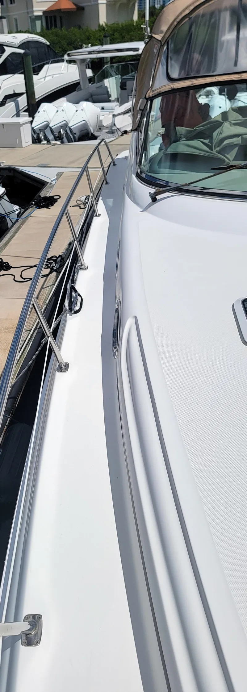 Slide: The Image of Side view of a 2000 Sea Ray 380 Sundancer yacht docked at a marina. - 48