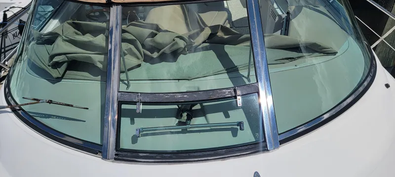 Slide: The Image of Sea Ray 380 Sundancer 2000 windshield with wipers and canvas cover. - 49