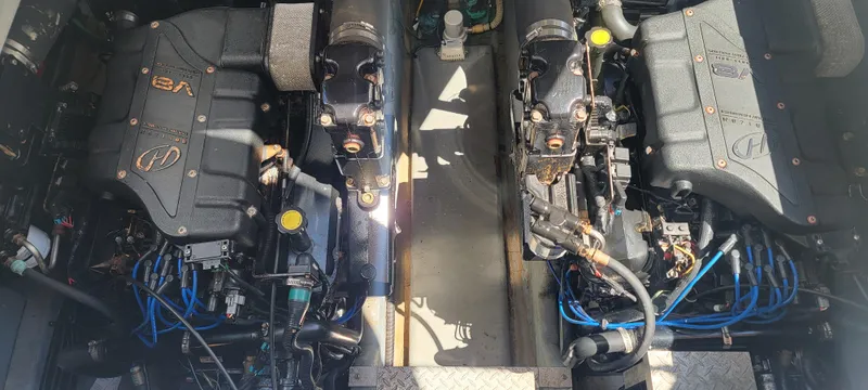 Slide: The Image of Nice clean engine area with a pair of 454 Mercruisers - 5