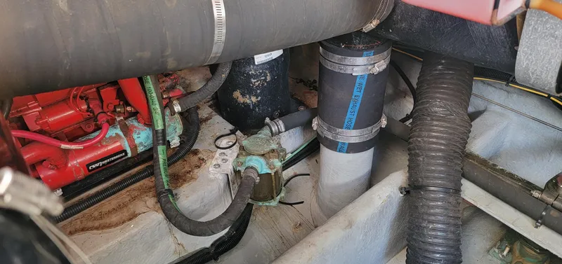 Slide: The Image of Engine compartment of 2000 Sea Ray 380 Sundancer with visible hoses and components. - 7