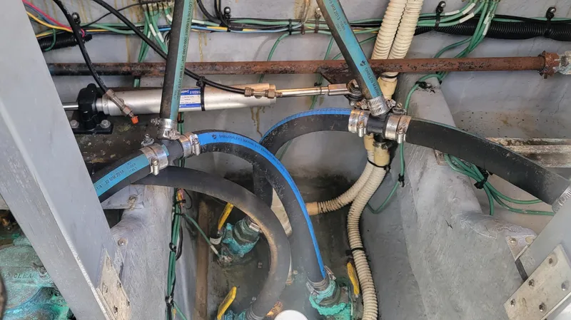 Slide: The Image of Engine compartment of 2000 Sea Ray 380 Sundancer with hoses and wiring. - 8