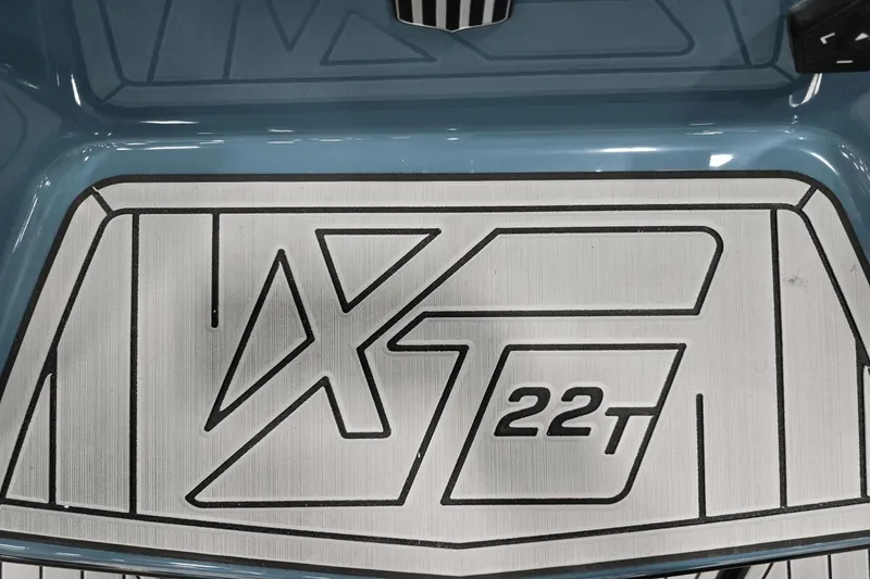 Slide: The Image of 2025 MasterCraft XT22 T logo on a sleek blue surface. - 17