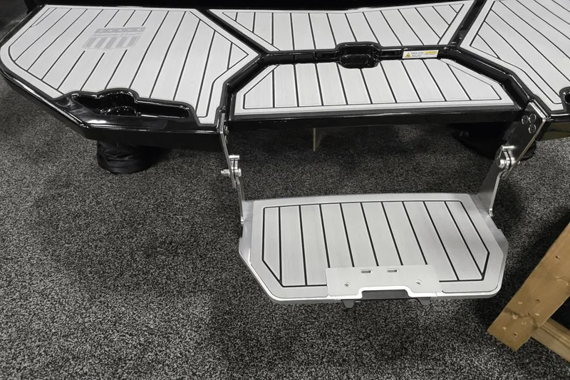 Slide: The Image of 2025 MasterCraft XT22 T boat platform with foldable step, featuring sleek design and durable materials. - 19