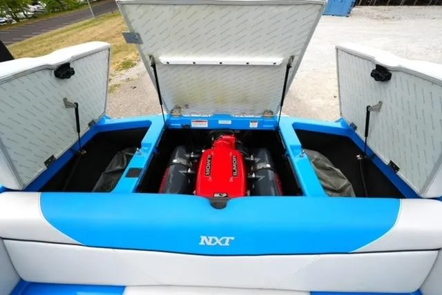Slide: The Image of 2016 MasterCraft NXT20 boat engine compartment with open hatches, showcasing the Ilmor engine. - 10