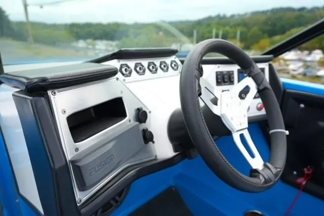 Slide: The Image of 2016 MasterCraft NXT20 boat dashboard with steering wheel and control panel. - 12