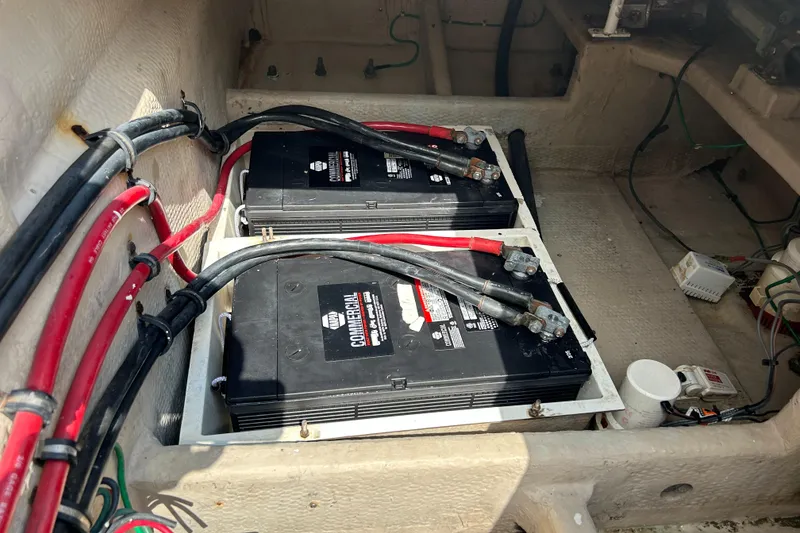 Slide: The Image of Battery compartment of a 1990 Viking 38 Convertible boat with wiring connections. - 25