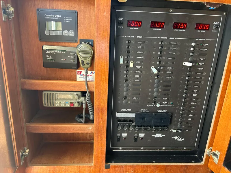 Slide: The Image of Electrical control panel on a 1990 Viking 38 Convertible boat, featuring Cummins Onan generator. - 5