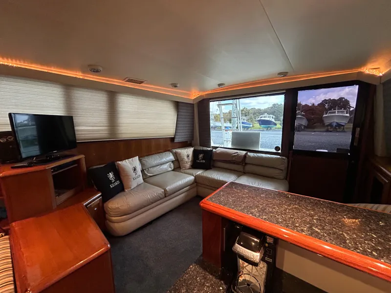 Slide: The Image of Luxurious interior of a 1990 Viking 38 Convertible yacht with leather seating and modern amenities. - 7