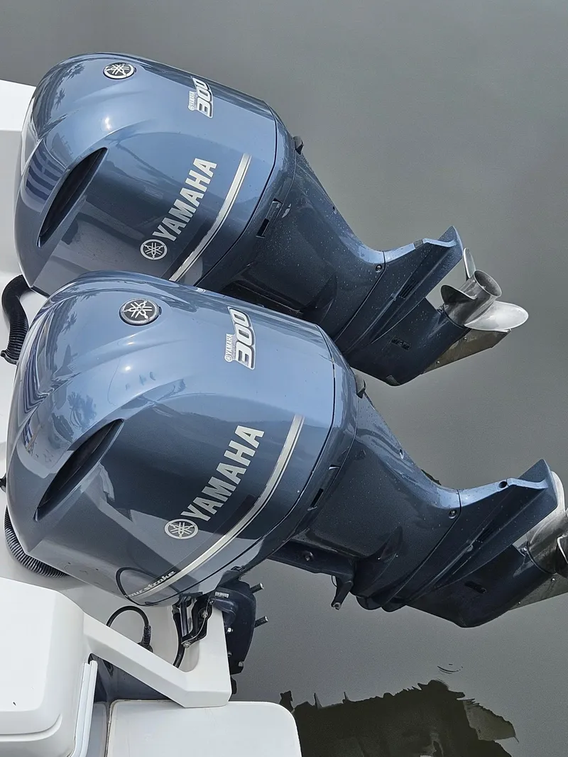Slide: The Image of Twin Yamaha outboard engines on a 2005 Intrepid 323 Cuddy boat. - 16