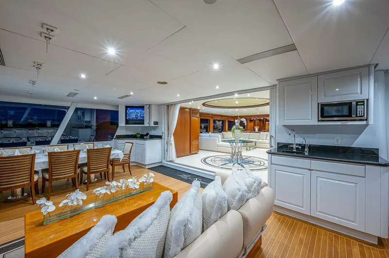 Slide: The Image of Luxurious interior of 2000 Christensen 141 Raised Pilothouse yacht with elegant dining and lounge areas. - 12