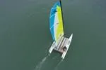 Slide: The Image of Aerial view of 2024 Hobie Cat Club WAVE sailing on calm water. - 5