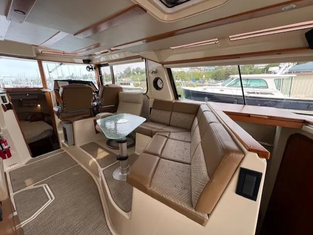 Slide: The Image of Interior of 2019 Ranger Tugs R-41 CB with spacious seating and modern design. - 14
