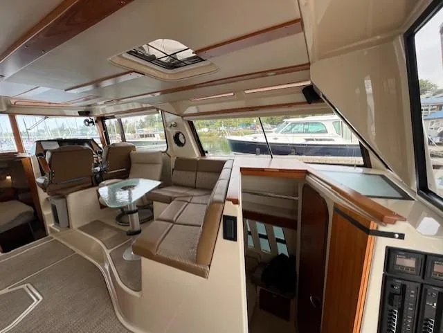 Slide: The Image of Interior of 2019 Ranger Tugs R-41 CB, featuring seating and helm station. - 15