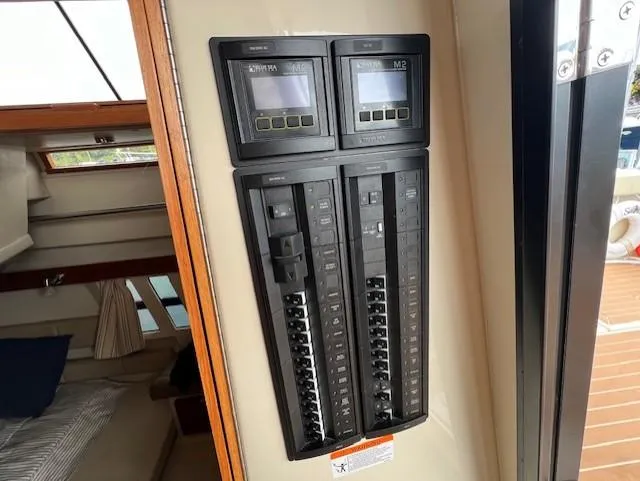 Slide: The Image of Electrical panel inside 2019 Ranger Tugs R-41 CB boat cabin. - 21