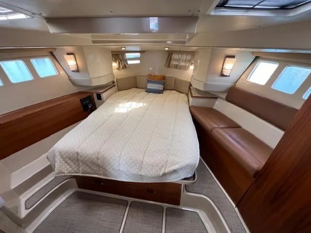 Slide: The Image of Luxurious cabin interior of 2019 Ranger Tugs R-41 CB with cozy bed and seating. - 31
