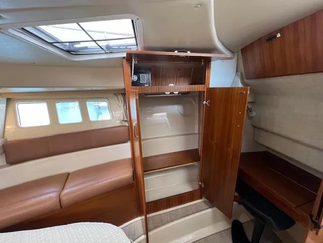 Slide: The Image of 2019 Ranger Tugs R-41 CB interior with wood cabinetry and seating. - 32