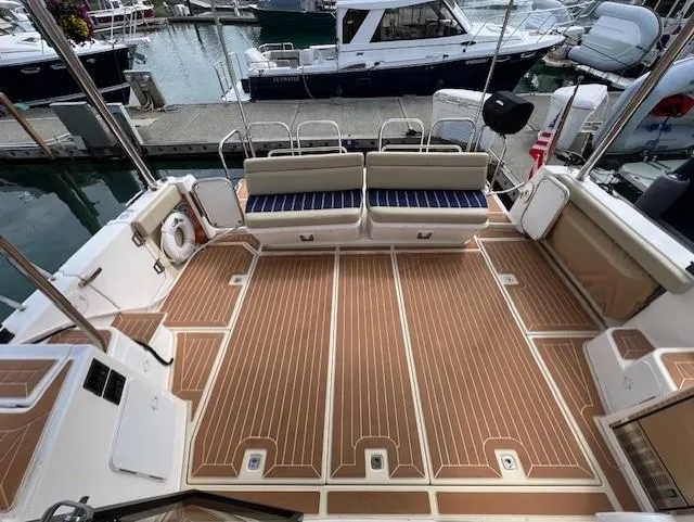 Slide: The Image of 2019 Ranger Tugs R-41 CB boat deck with seating, docked at marina. - 7