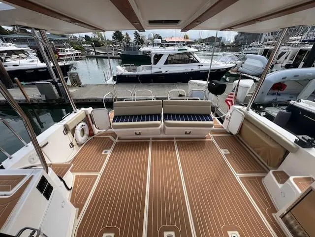 Slide: The Image of 2019 Ranger Tugs R-41 CB boat deck with seating, docked at marina. - 8