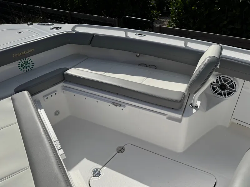 Slide: The Image of 2024 Everglades 253 Center Console boat interior with cushioned seating and speaker. - 13
