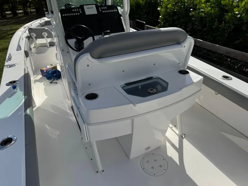 Slide: The Image of 2024 Everglades 253 Center Console boat interior with seating and console. - 30