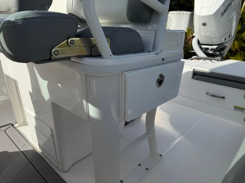 Slide: The Image of 2024 Everglades 253 Center Console boat interior with seating and storage. - 32