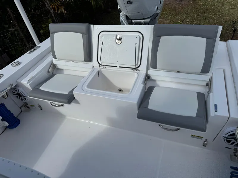 Slide: The Image of 2024 Everglades 253 Center Console boat seating and storage area. - 37