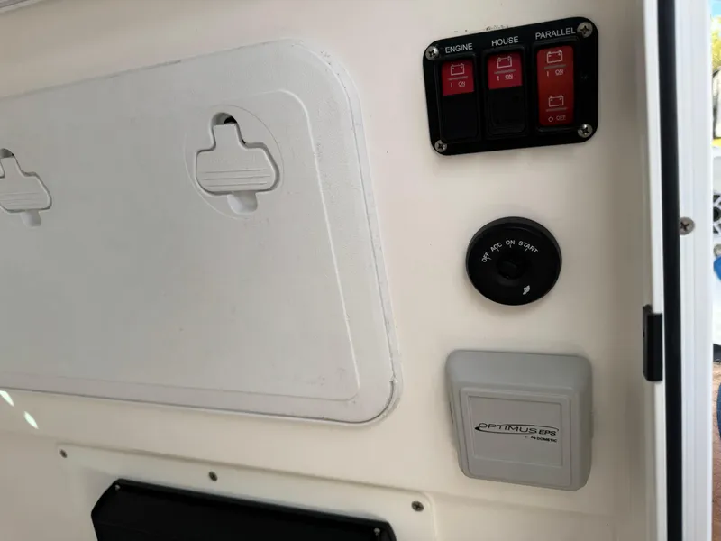 Slide: The Image of 2024 Everglades 253 Center Console control panel with switches and gauges. - 41