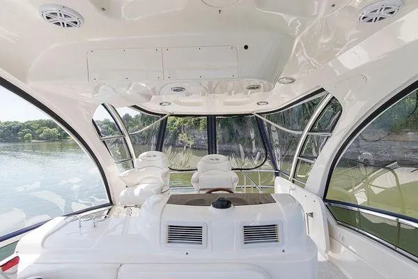 Slide: The Image of Interior view of 2005 Sea Ray 500 Sedan Bridge yacht with panoramic windows. - 12