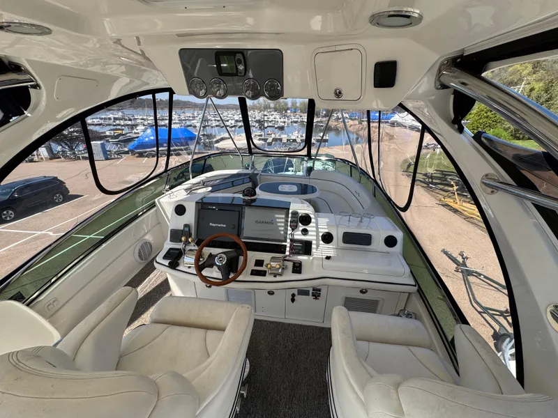 Slide: The Image of Interior view of 2005 Sea Ray 500 Sedan Bridge yacht cockpit with steering wheel and controls. - 15
