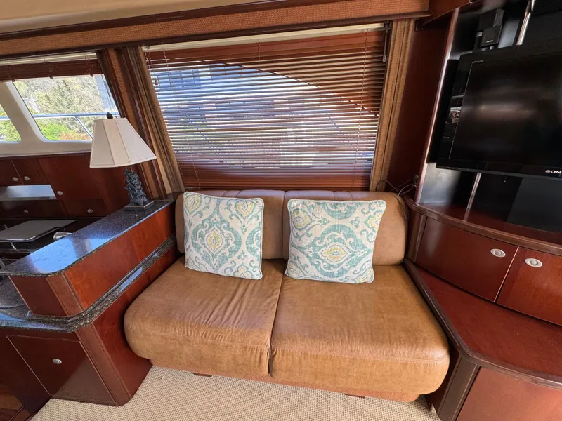 Slide: The Image of Luxurious interior of 2005 Sea Ray 500 Sedan Bridge yacht with cozy seating and elegant decor. - 40