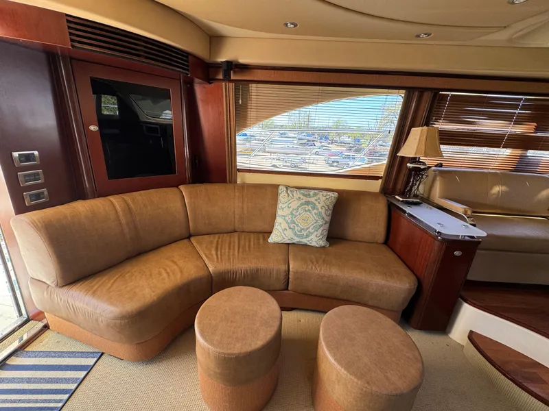 Slide: The Image of Luxurious interior of 2005 Sea Ray 500 Sedan Bridge yacht with leather seating and elegant decor. - 41