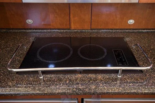 Slide: The Image of Stovetop on granite counter in 2005 Sea Ray 500 Sedan Bridge yacht kitchen. - 48