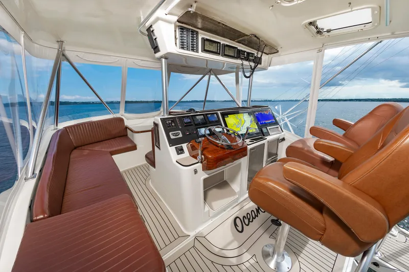 Slide: The Image of Luxurious 2005 Ocean Yachts Super Sport helm with leather seating and advanced navigation systems. - 13