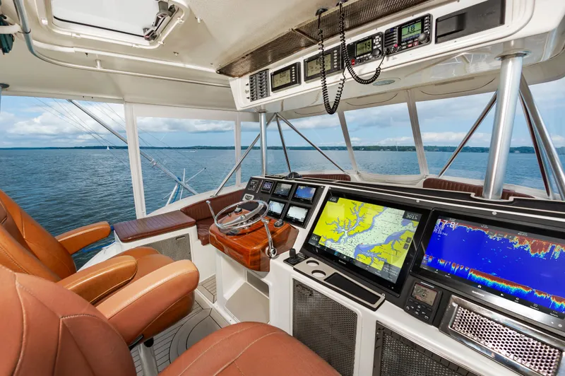 Slide: The Image of Interior of 2005 Ocean Yachts Super Sport with advanced navigation systems and leather seating. - 14