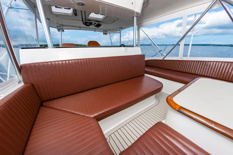 Slide: The Image of Luxurious interior of 2005 Ocean Yachts Super Sport with brown leather seating. - 17