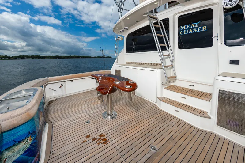 Slide: The Image of 2005 Ocean Yachts Super Sport deck with fishing setup and ocean view. - 21