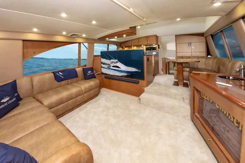 Slide: The Image of Luxurious interior of 2005 Ocean Yachts Super Sport with plush seating and ocean view. - 25
