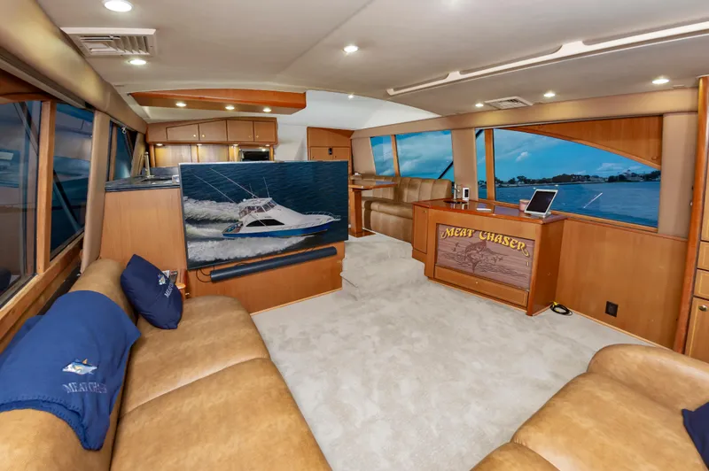 Slide: The Image of Luxurious interior of 2005 Ocean Yachts Super Sport with leather seating and scenic windows. - 26