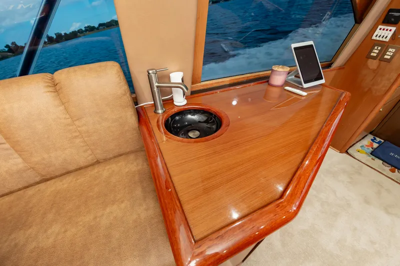Slide: The Image of Luxurious interior of 2005 Ocean Yachts Super Sport with wood finish and modern amenities. - 28