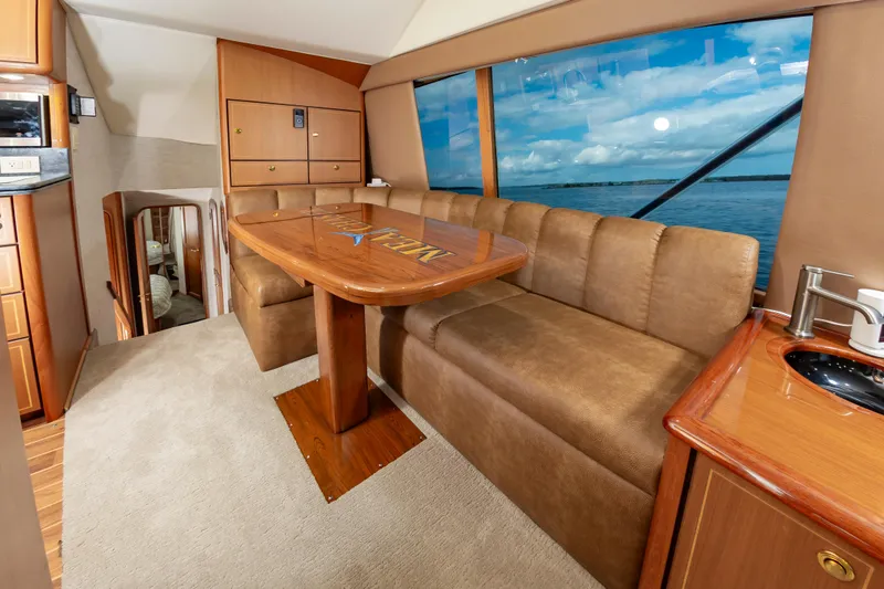 Slide: The Image of Luxurious interior of 2005 Ocean Yachts Super Sport with plush seating and ocean view. - 29