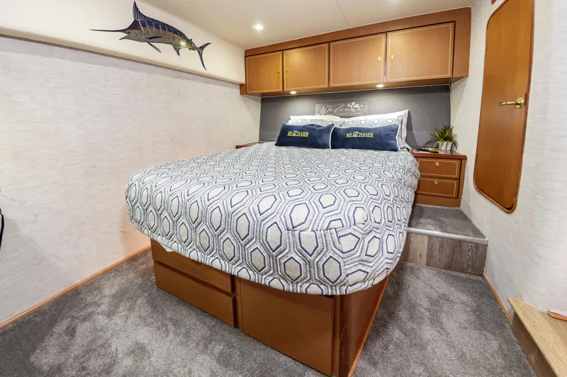 Slide: The Image of Luxurious 2005 Ocean Yachts Super Sport bedroom with elegant decor and comfortable bedding. - 38