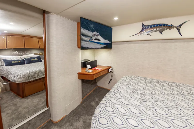 Slide: The Image of Interior of 2005 Ocean Yachts Super Sport with cozy bedroom and nautical decor. - 39