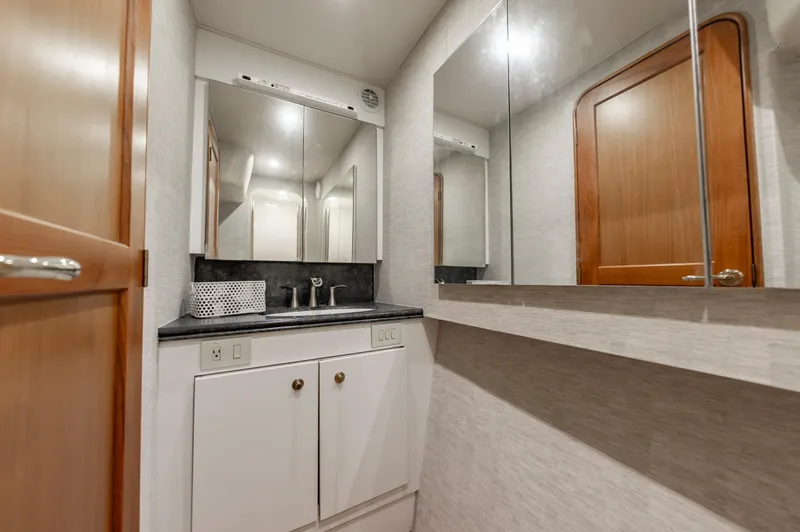 Slide: The Image of Luxurious bathroom in 2005 Ocean Yachts Super Sport, featuring modern fixtures and elegant design. - 41