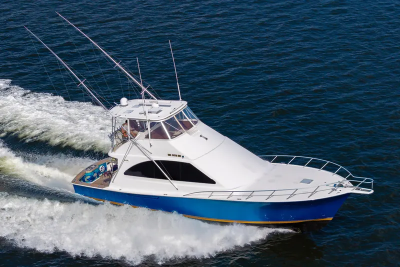 Slide: The Image of 2005 Ocean Yachts Super Sport cruising on open water. - 5