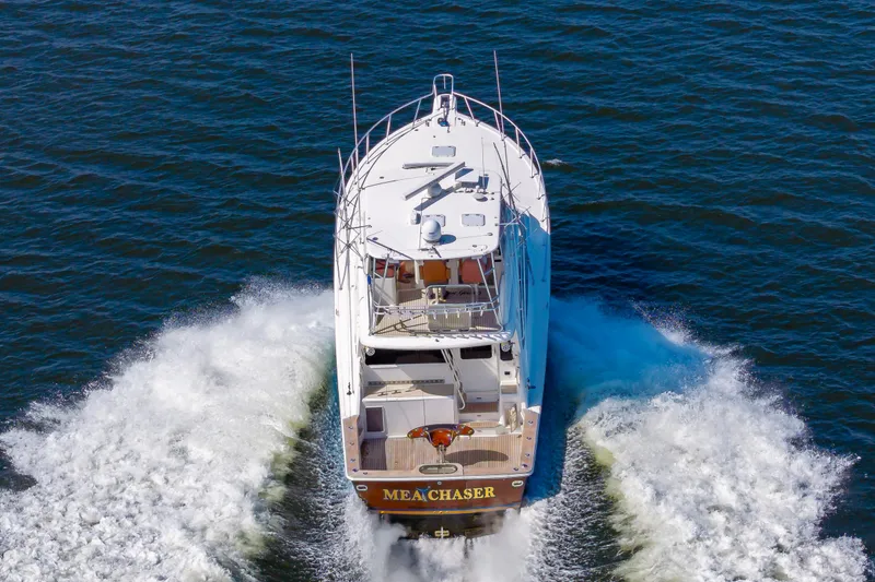 Slide: The Image of 2005 Ocean Yachts Super Sport cruising on open water, rear view. - 6