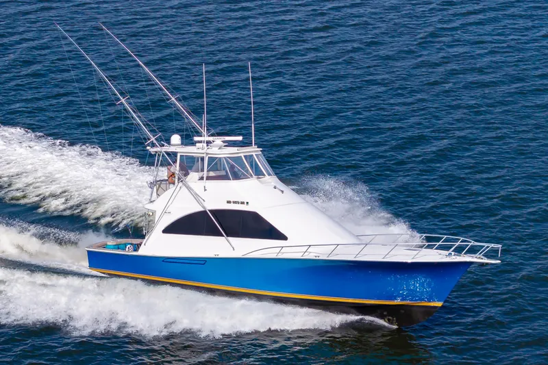 Slide: The Image of 2005 Ocean Yachts Super Sport cruising on open water. - 7